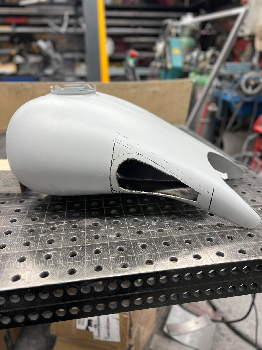 Reshaped and rewelded fuel tank
