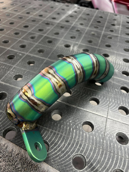 Green anodised titanium exhaust segment