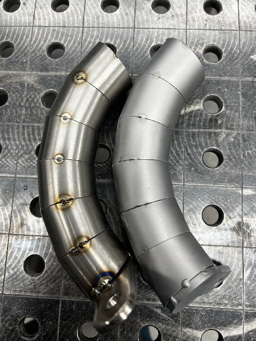 Tack-welded exhaust sections
