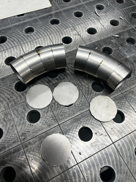Exhaust segments cut from straight tubing